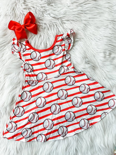 Girls baseball print dress with flutter sleeves, red and white stripes, and all over baseball print. Girls Baseball dress.