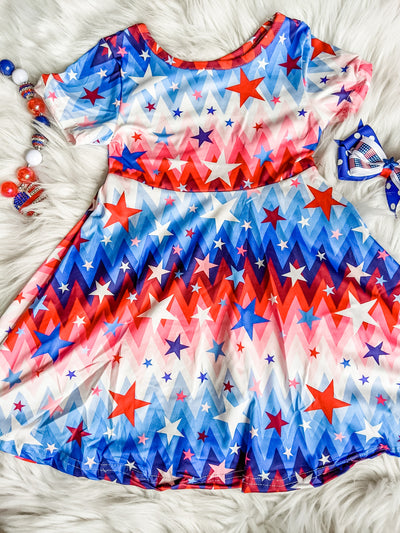 Girls patriotic twirl dress with stars and a red, white, and blue gradient pattern