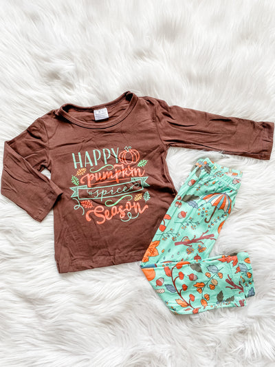 Girls two piece leggings set with brown long sleeve shirt, feature Happy Pumpkin Spice Season saying on the front. Girls fall leggings with teal background and fall print.