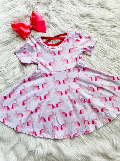 Girls pink twirl dress with pink ombre rabbits and a criss cross back. 