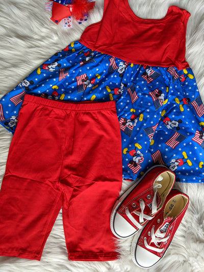 Girls two piece capris set with red capris bottoms and a blue and red tunic style tank top with patriotic mouse holding American flags. 