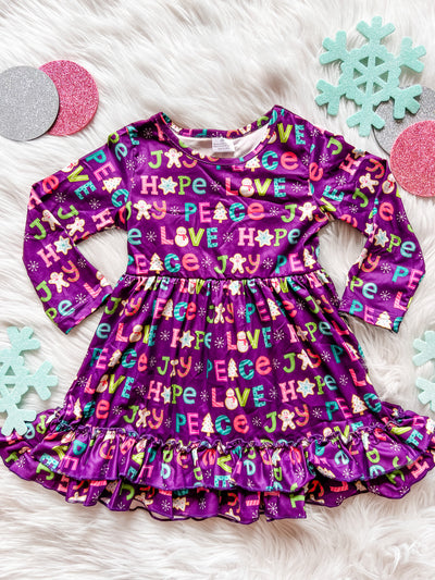 Purple long sleeve ruffle hem dress with Christmas saying and cookie pattern. 