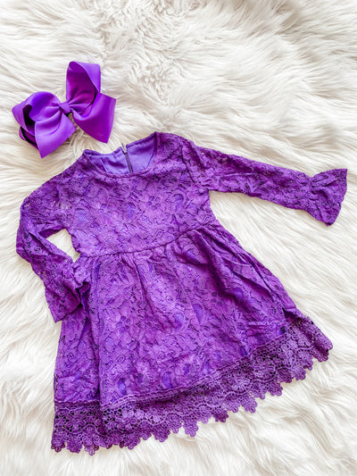 Purple lace dress with bell sleeves and a delicate lace trim.