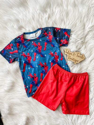 Two piece pajama set with red bottoms and spidy printed short sleeve top. 