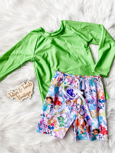 Boys two piece swimsuit with green long sleeve rash guard and magical swim shorts. 