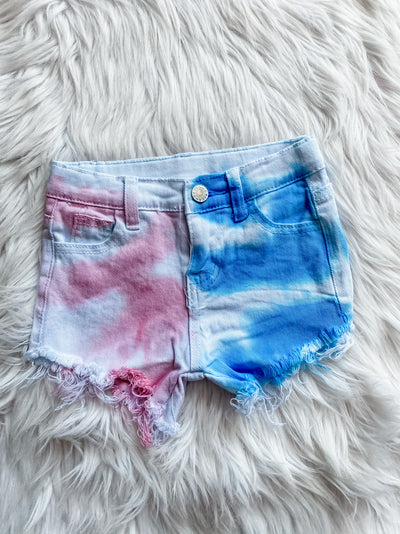 Girls distressed denim shorts with red and blue tie dye. 