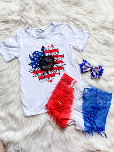 Girls july 4th outfit with red white and blue distressed jean shorts & short sleeve white tee with American flag