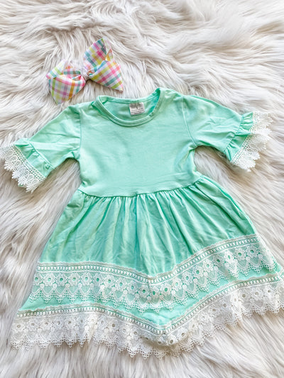 Girls teal dress with white lace trim. 