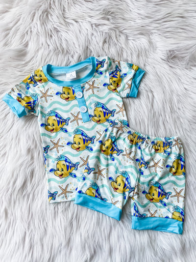 Kids two piece pajama set with blue short sleeve top and shorts with Flounder and starfish on it. 
