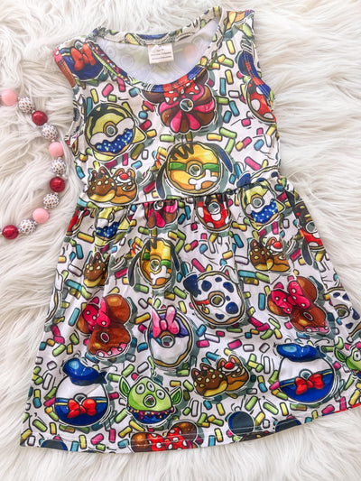 Sleeveless dress for girls with delicious park treat donuts print. Perfect for day at the most magical place on earth outfit.