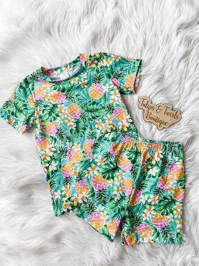 Kids summer pajamas with watercolor pineapple print. Kids short sleeve pajamas from Orlando Children's Boutique