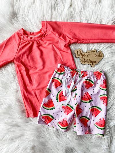 Boys swim set with red long sleeve rashguard and coordinating watermelon print shorts. Elastic waist and drawstring. Kids boutique swimsuit