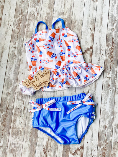 Girls two piece July 4th bathing suit. Adorable tankini with ruffle bottom and adorable tie bottoms in a sweet patriotic ice cream print