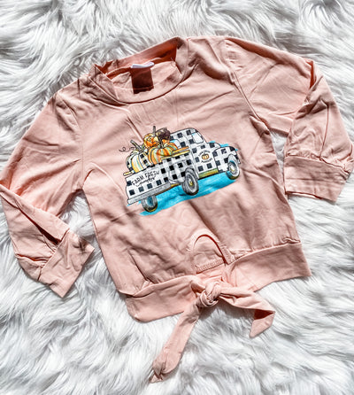 Adorable knot front tee for girls with graphic print vintage truck and pumpkins in a pretty blush color.