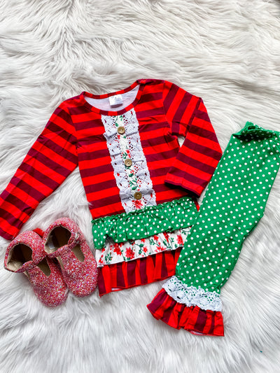 Two piece girls long sleeve Christmas set with red stripes, white lace trim, and three ruffles on the bottom. Includes matching green and white polka dot ruffle leggings. 