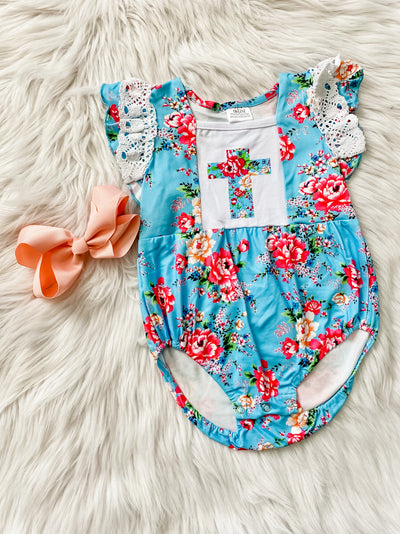 Blue romper for baby with white lace sleeves and red flowers with a matching floral cross in the center. Girls easter romper.