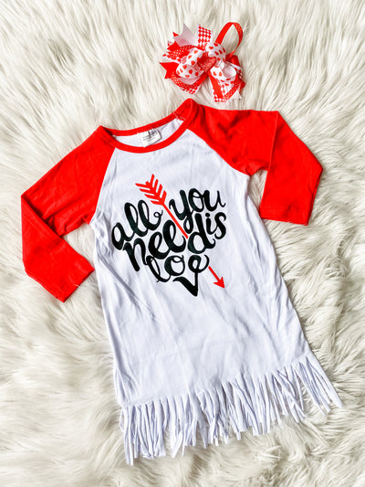 Girl's Valentine's Day Dress for Valentine's Day Party. Adorable White fringe dress with red long sleeves and the saying all you need is love in black with a red arrow. 