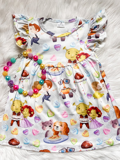 Girls short sleeve flutter sleeve dress with white background and famous couples print with conversation hearts. 