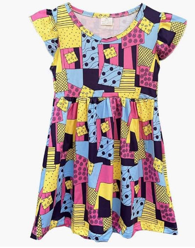 Girls Sally inspired dress with patchwork design in yellow, blue and pink. 