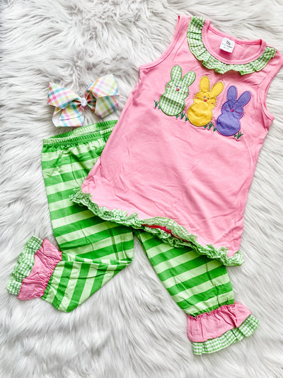 Two piece girls Easter set with pink top that has embroidered peeps rabbits and a plaid green and white ruffle trim. The bottoms are green stripes with pink and plaid ruffle bottoms. 