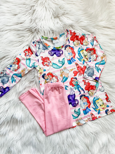 Girls two piece outfit with pink leggings and a pink and white striped long sleeve top with famous under the sea friends. 