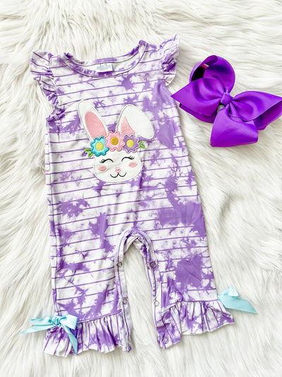 Infant girls ruffle romper with purple and white tie dye design and an embroidered bunny on the front. 