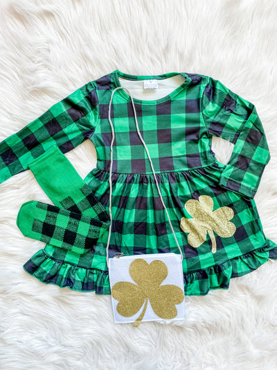 Super sweet Girls St. Patricks Day Outfit. long sleeve green and black plaid dress with a gold clover, matching knee high plaid socks, and clover purse. 
