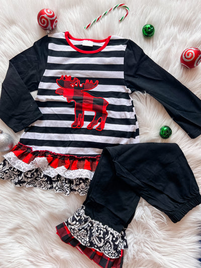 Two piece girls set with long sleeve black and white striped top with red plaid embroidered moose and black ruffle leggings. 