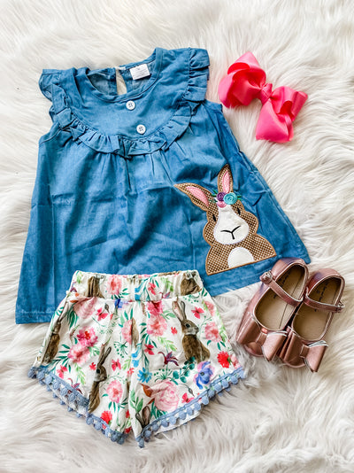 Girls two piece set with denim top with embroidered brown rabbit and pom pom hem shorts with flowers and brown rabbit print. 