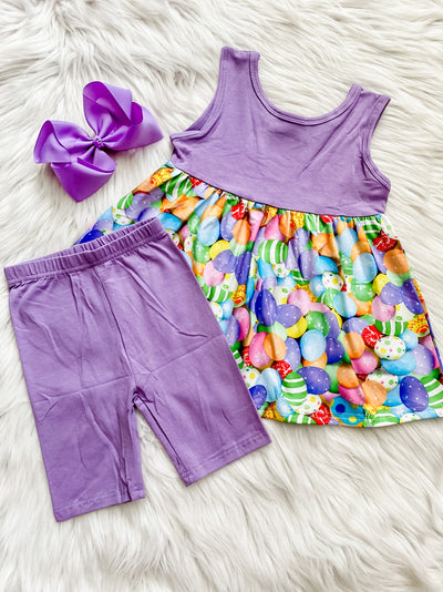 Two piece girls shorts set with tunic top with color eggs and matching purple biker shorts. 