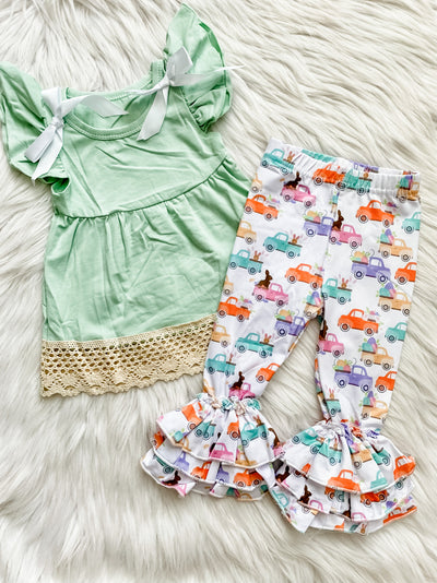 Two piece girls set with mint shirt with crochet hem and triple ruffle truck pants. 
