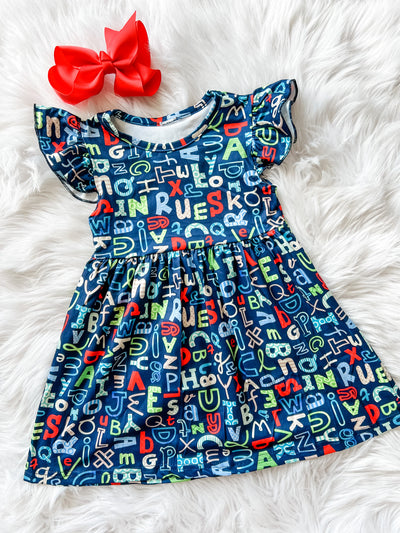 Girls back to school dress. Flutter sleeve fun and whimsical print alphabet print back to school dress for girls