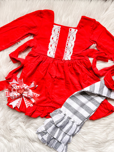 Girls Valentine's Day outfit with long sleeve red top, ruffle bottom, and triple ruffle leggings. 