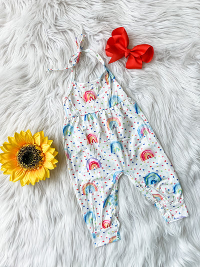 Girls white romper with all over boho rainbow print tie neck and snap closure. Girls romper for summer